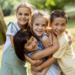 Kids hugging and smiling